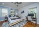Serene bedroom featuring calming blue walls, soft rug, and modern decor at 6018 Ridgecrest Ave, Hanahan, SC 29410