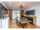 Stylish dining room with modern sliding doors, hardwood floors and black modern accent wall at 6018 Ridgecrest Ave, Hanahan, SC 29410