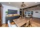 Modern dining room featuring hardwood floors, decorative buffet, and stylish black accents at 6018 Ridgecrest Ave, Hanahan, SC 29410