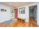 Inviting foyer with hardwood floors, a bench with storage, and a decorative mirror creates a warm welcome at 6018 Ridgecrest Ave, Hanahan, SC 29410