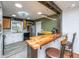 Cozy kitchen offering white and wood cabinets, stainless appliances, butcher block counters and barstool seating at 6018 Ridgecrest Ave, Hanahan, SC 29410