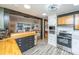 Modern kitchen featuring wood countertops, stainless steel appliances, open concept design and gray wood flooring at 6018 Ridgecrest Ave, Hanahan, SC 29410