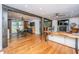 Spacious open-concept living area featuring hardwood floors, exposed beams, and a seamless flow to dining at 6018 Ridgecrest Ave, Hanahan, SC 29410