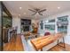 Bright living room featuring hardwood floors, a cozy fireplace, and ample natural light from the large window at 6018 Ridgecrest Ave, Hanahan, SC 29410