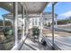 Cozy back porch with screened windows and a view of the outdoor area and patio at 614 Beach Way, Summerville, SC 29486