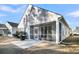 Beautiful backyard with a screened-in porch, grill, and spacious patio for outdoor enjoyment at 614 Beach Way, Summerville, SC 29486