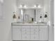 A bright bathroom featuring a double vanity with modern fixtures at 614 Beach Way, Summerville, SC 29486
