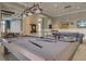 A modern billiards room provides an area to play and relax with televisions and stylish lighting fixtures at 614 Beach Way, Summerville, SC 29486