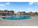 Large community pool surrounded by lounge chairs, umbrellas, and inviting spaces for relaxation and socializing at 614 Beach Way, Summerville, SC 29486