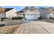 Charming single-Gathering home featuring a two-car garage, complimented with a well-manicured lawn, driveway, and sidewalk at 614 Beach Way, Summerville, SC 29486