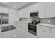 Contemporary kitchen with stainless appliances, stylish backsplash, and plenty of cabinet space at 614 Beach Way, Summerville, SC 29486