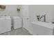 The laundry room features modern appliances and a sink for added convenience at 614 Beach Way, Summerville, SC 29486
