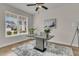 Bright office space featuring a modern desk, stylish decor, and large windows providing ample natural light at 614 Beach Way, Summerville, SC 29486
