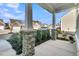 Inviting porch view with stone-accented columns and lush landscaping, creating a warm and welcoming entrance at 614 Beach Way, Summerville, SC 29486