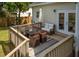 Cozy back deck features a dining table, outdoor seating, and a heater for outdoor entertaining at 68 Oyster Point Row, Charleston, SC 29412