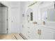 Bright bathroom featuring double sinks with modern hardware and white cabinetry at 68 Oyster Point Row, Charleston, SC 29412