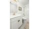 Bright bathroom featuring a white vanity, gold fixtures, framed art, and a shower-tub combination at 68 Oyster Point Row, Charleston, SC 29412