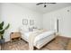 Bright bedroom featuring a ceiling fan, wood floors, and stylish decor at 68 Oyster Point Row, Charleston, SC 29412