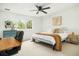 Bedroom featuring a ceiling fan, large window, desk, and stylish decor at 68 Oyster Point Row, Charleston, SC 29412
