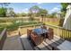 Inviting deck overlooking a lake, featuring a dining set, cozy furniture and a heating tower at 68 Oyster Point Row, Charleston, SC 29412