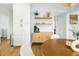 Bright dining area features built-in cabinets, wood-style floors and a round table with seating at 68 Oyster Point Row, Charleston, SC 29412