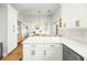 This kitchen features stainless appliances, white cabinets and an open floor plan at 68 Oyster Point Row, Charleston, SC 29412
