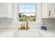 A sunny kitchen sink with a view of the lake at 68 Oyster Point Row, Charleston, SC 29412