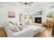 Bright living room featuring a cozy fireplace and ample natural light at 68 Oyster Point Row, Charleston, SC 29412