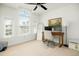 Bright home office with natural light, desk setup, two computer monitors, and a ceiling fan at 68 Oyster Point Row, Charleston, SC 29412