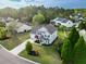 Beautifully landscaped home boasts a manicured lawn, mature trees, and inviting curb appeal in a Gathering-friendly neighborhood at 7483 Hawks Cir, Hanahan, SC 29410
