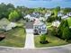 Aerial view of a well-maintained home with a lush green lawn and mature trees in a Gathering-friendly neighborhood at 7483 Hawks Cir, Hanahan, SC 29410