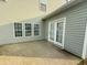 Back patio with bright, white windows and a set of patio doors at 7483 Hawks Cir, Hanahan, SC 29410