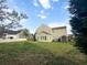 Spacious backyard with a shed and a black metal fence at 7483 Hawks Cir, Hanahan, SC 29410
