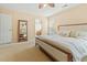 This spacious bedroom features neutral walls, plush carpet, and a stylish full-length mirror at 7483 Hawks Cir, Hanahan, SC 29410