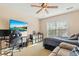 Modern bedroom featuring a large flat screen, a gaming chair, and lots of storage at 7483 Hawks Cir, Hanahan, SC 29410