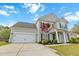 Charming home with a well-manicured front yard and an attached two-car garage at 7483 Hawks Cir, Hanahan, SC 29410