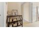 A hallway featuring beige walls, carpet flooring, and a dark wood bookshelf at 7483 Hawks Cir, Hanahan, SC 29410
