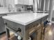 A kitchen island featuring white countertops, wooden base, and towel rack at 7483 Hawks Cir, Hanahan, SC 29410