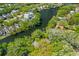 Aerial view overlooking waterway winding through dense trees and houses at 753 Lake Frances Dr, Charleston, SC 29412