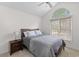 Well-lit bedroom with a ceiling fan, light-blocking blinds, and dark wood bedroom furniture at 753 Lake Frances Dr, Charleston, SC 29412