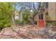 Relax on the waterfront deck with chairs, lounge and stairs leading up to the house at 753 Lake Frances Dr, Charleston, SC 29412