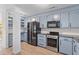 Charming kitchen with stainless steel appliances, custom cabinets and wood flooring at 753 Lake Frances Dr, Charleston, SC 29412