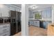 Bright kitchen features stainless steel appliances, stone countertops, and ample cabinet space at 753 Lake Frances Dr, Charleston, SC 29412