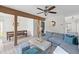 Bright and airy living room with a comfortable sofa, modern decor, and open access to the dining area at 753 Lake Frances Dr, Charleston, SC 29412