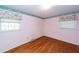 Bedroom featuring hardwood floors, natural light, and a floral wallpaper border at 783 Dills Bluff Rd, Charleston, SC 29412