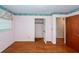 Bedroom featuring hardwood floors with closet and doorway that leads into the next room at 783 Dills Bluff Rd, Charleston, SC 29412