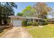 Attractive brick home with an attached garage, neat landscaping, and a welcoming front porch at 783 Dills Bluff Rd, Charleston, SC 29412