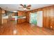 Open-concept living area with hardwood floors seamlessly connects to the kitchen with access to the deck at 783 Dills Bluff Rd, Charleston, SC 29412