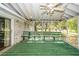 Enclosed porch with wood bench seating, overhead ceiling fan, and views of the backyard at 783 Dills Bluff Rd, Charleston, SC 29412