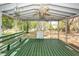 Enclosed porch with wood bench seating, overhead ceiling fan, and views of the backyard at 783 Dills Bluff Rd, Charleston, SC 29412